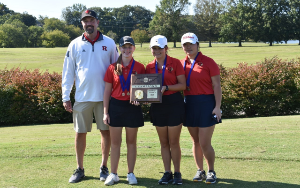 Girls golf team with their region championship plaque
