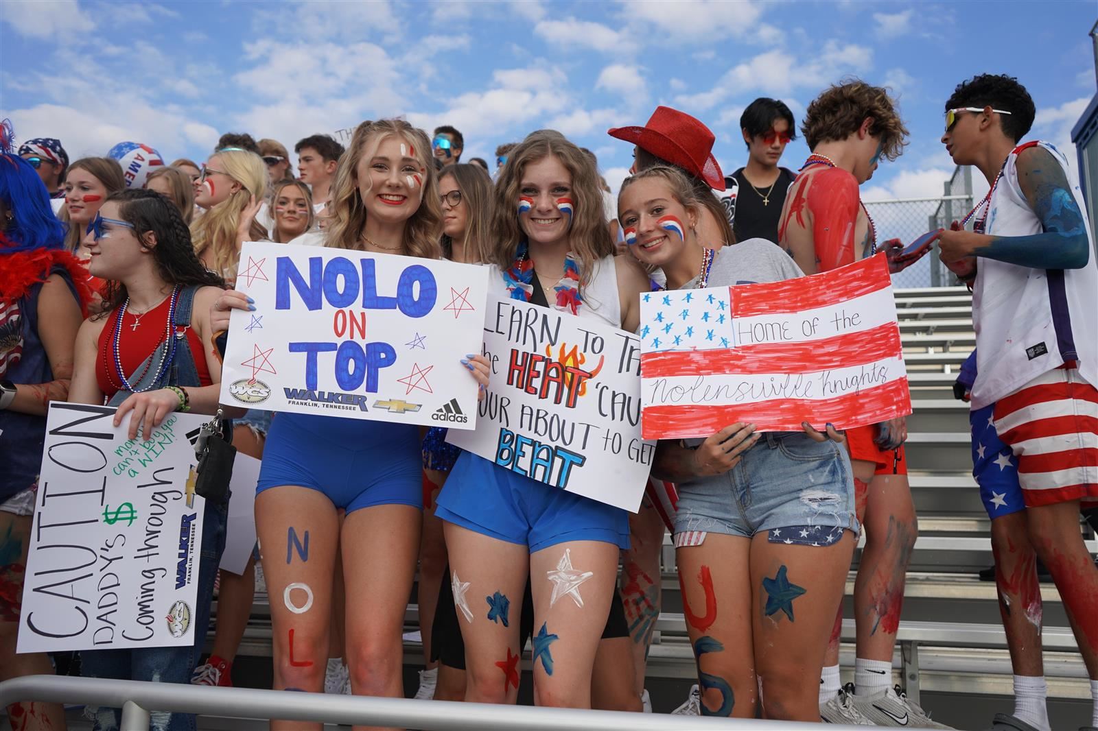Students holding signs
