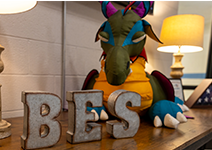  BES block letters with stuffed animal dragon