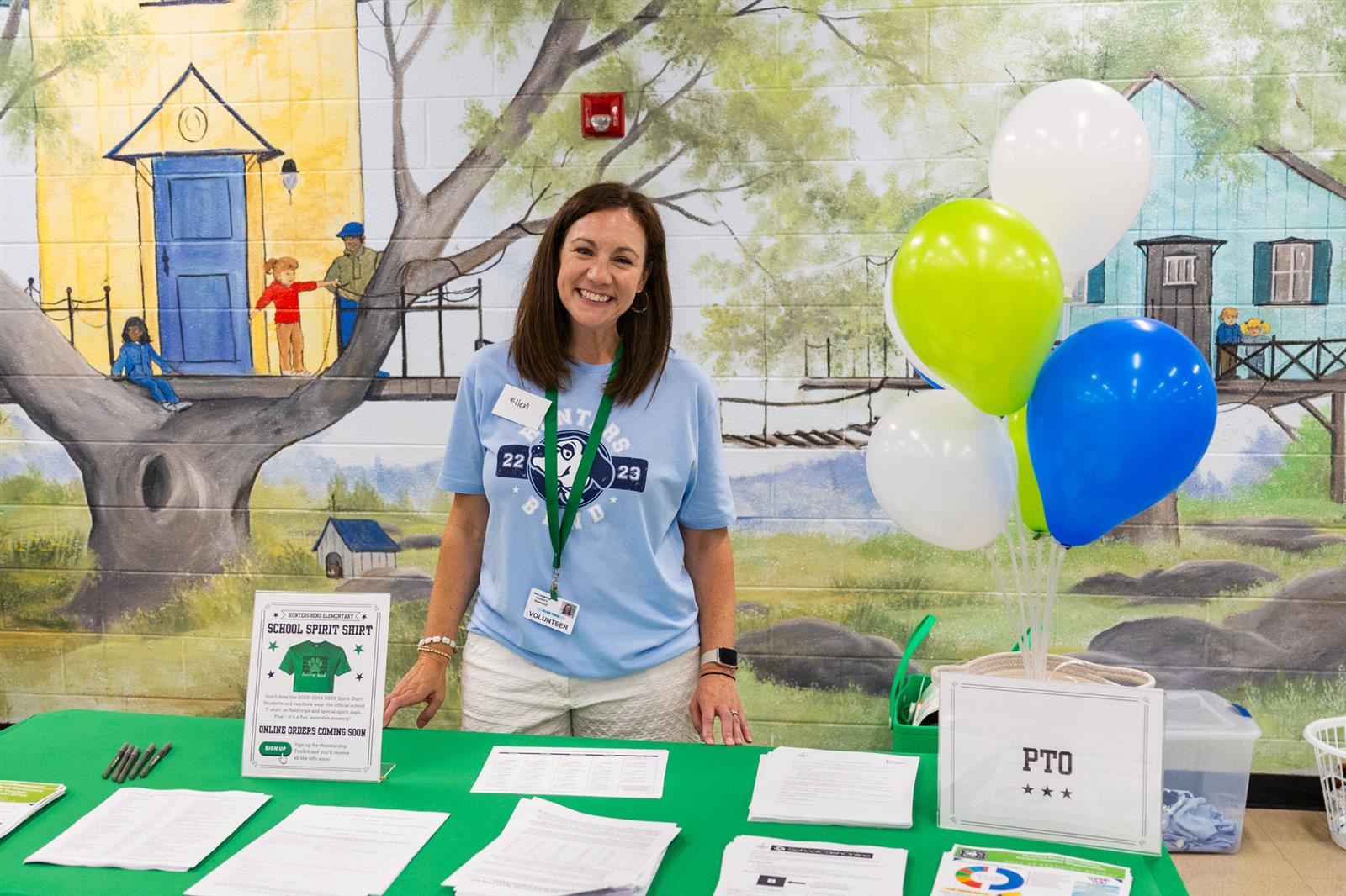 woman standing at a PTO table
