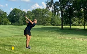 Girl playing golf