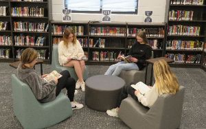 Students reading in media center