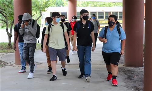 Students walk into schools 