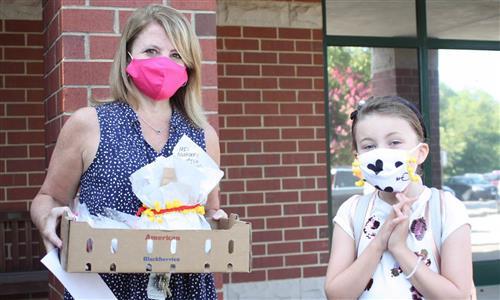 Teacher and student in masks 