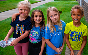  group of four students outside smiling