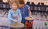  girl playing a drum