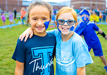  two girls with blue facepaint on