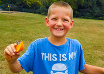  boy with an orange slice