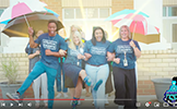  four teachers dancing with umbrellas