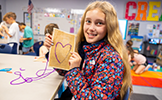  girl holding art