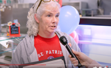 woman talking into microphone 