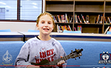  girl playing ukelele