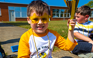  boy in yellow sunglasses