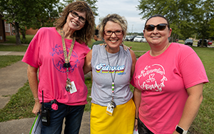  three ladies smiling outside