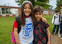  two students smiling outside of FES