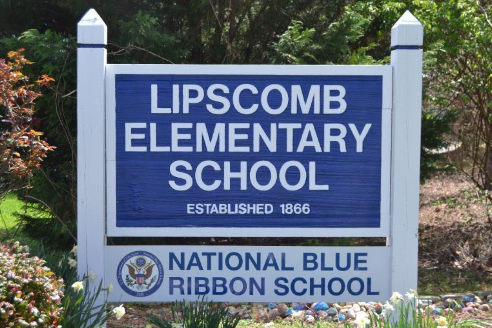 The sign in front of school that says "Lipscomb Elementary Established in 1866