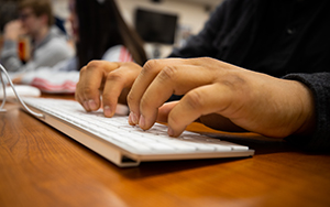 Hands on computer keyboard 