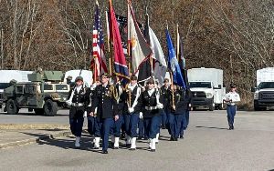  JROTC students carrying the flags
