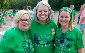  three teachers in green shirts