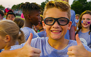  boy giving a thumbs up