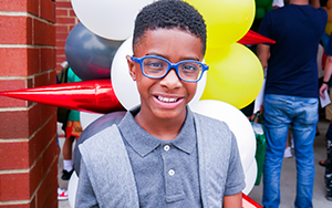 boy in front of balloons