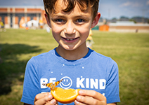  boy with orange and butterfly
