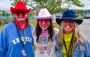 three teachers in cowboy hats 