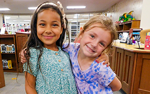  two girls smiling