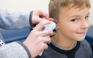  Student having his temperature taken in his ear