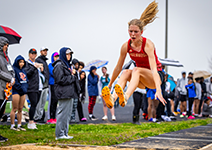  RHS student doing the long jump at a track meet