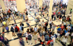  students hanging out in the commons area between classes