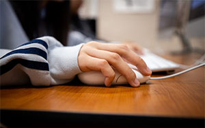 Close up of a hand on a computer mouse
