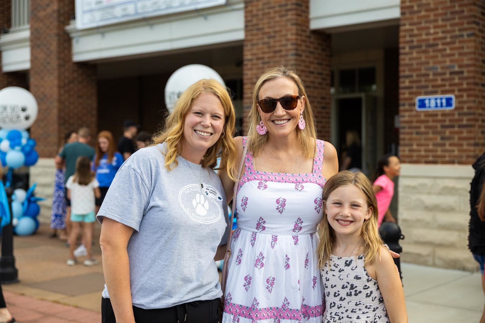 teacher, parent and student outside PCES
