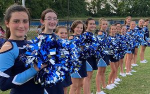 The TSMS Dance Team lines up at a football game.