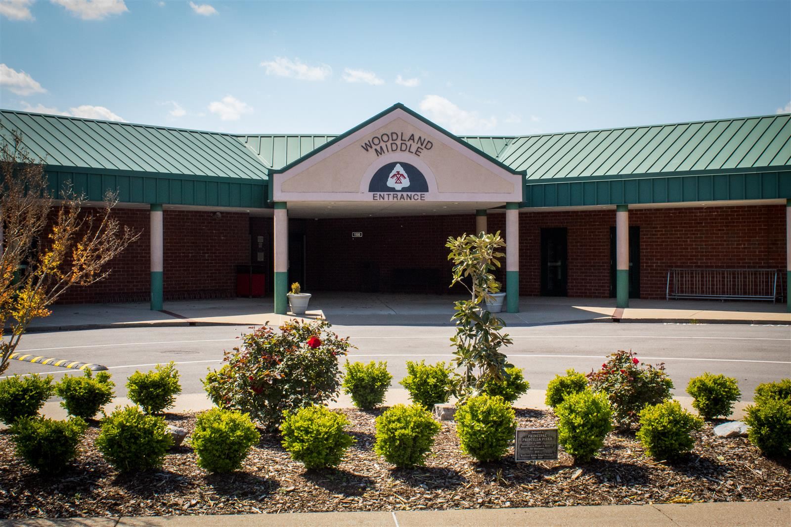 Image shows front entrance of Woodland Middle