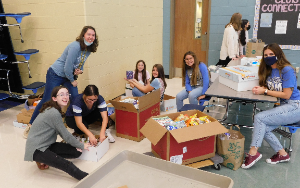   TSMS School Counselors work with students to sort donation during the Fall Service Day.