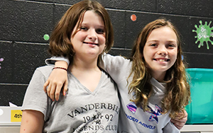 two girls smiling 