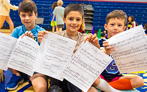  boys with music note papers