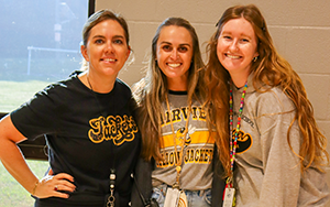  three teachers smiling