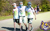  three boys walking with blue chalk on their faces