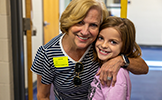  student and her grandma smiling