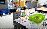  boy building a wheel with kinex blocks