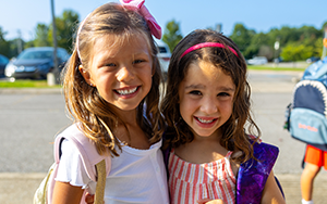  two girls smiling