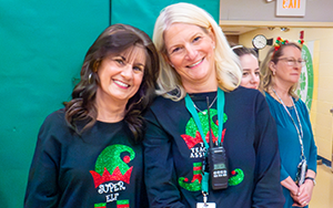  two teachers in matching black shirts