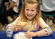  girl eating a donut