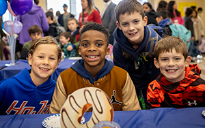  four boys smiling in cafeteria