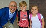  Principal Drew Perry with 2 children