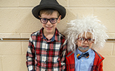  two boys dressed as 100 year olds with glasses