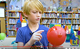 boy with red decorated balloon 