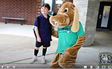  student and hound dog mascot